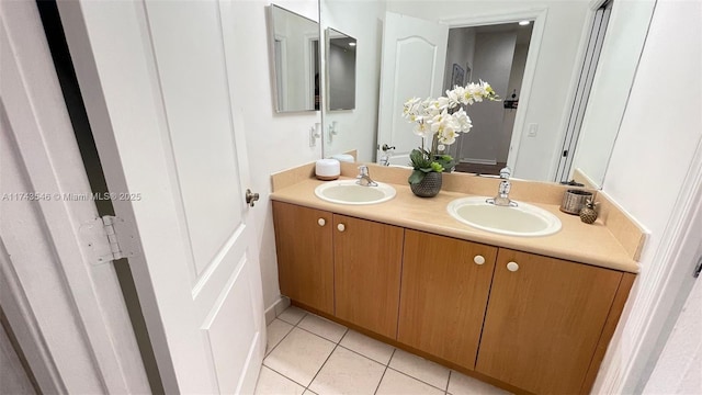 bathroom with tile patterned flooring, double vanity, and a sink