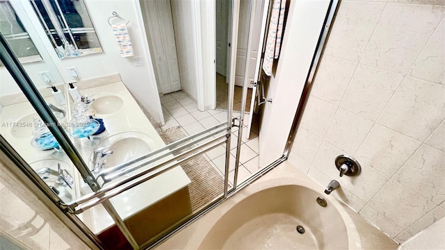 bathroom featuring a sink, double vanity, and tile patterned flooring