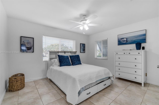 bedroom featuring light tile patterned floors and ceiling fan