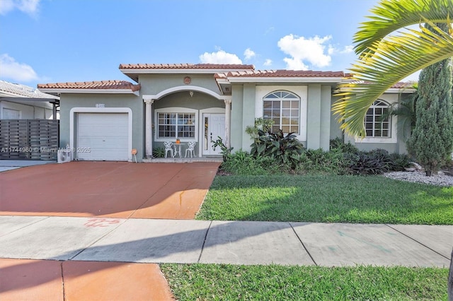 view of front of home with a garage and a front yard