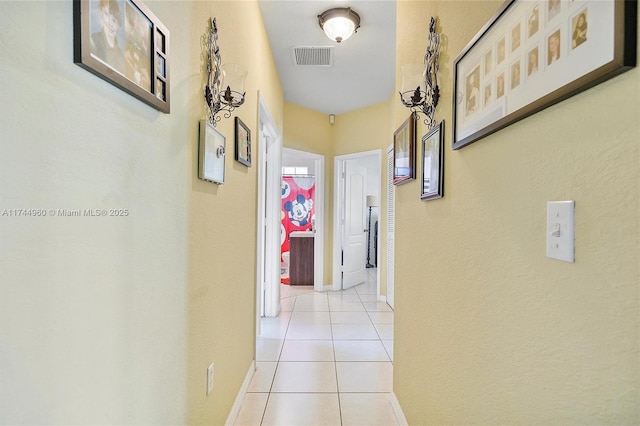 hallway with light tile patterned floors
