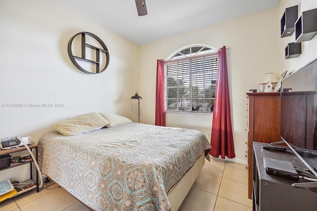 bedroom with ceiling fan and light tile patterned floors