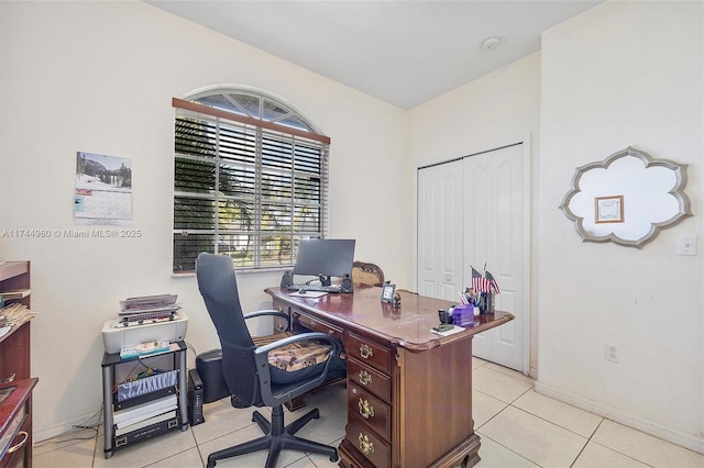 office space featuring plenty of natural light and light tile patterned flooring