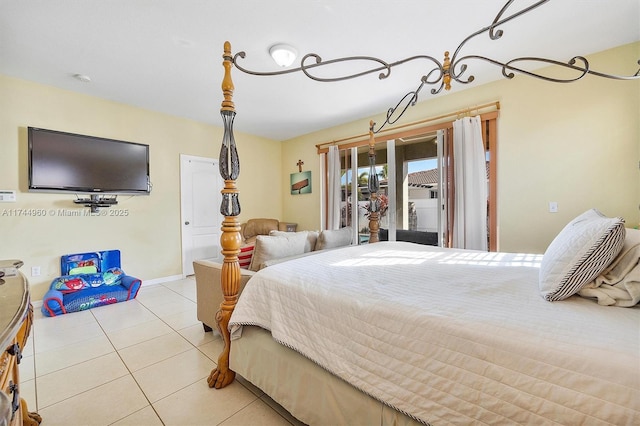 tiled bedroom featuring access to outside