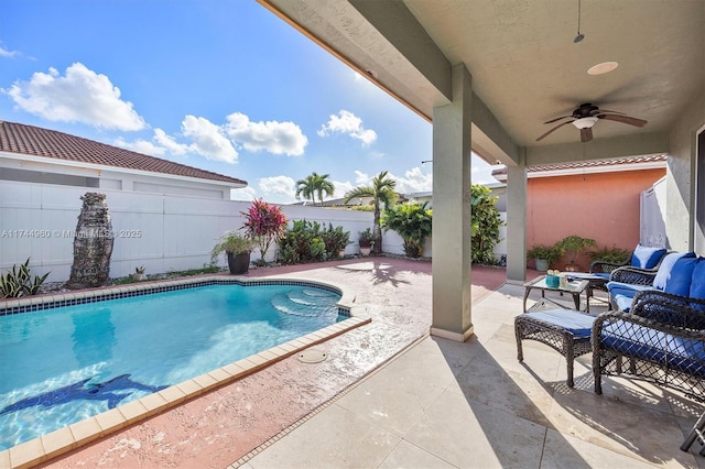 view of swimming pool with an outdoor hangout area, a patio, and ceiling fan