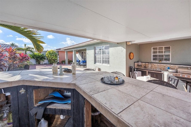 view of patio featuring an outdoor bar