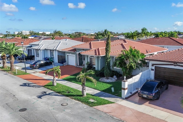 mediterranean / spanish home with a garage