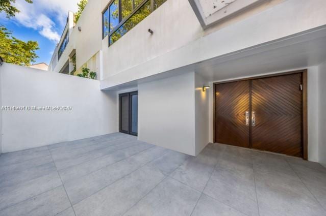 10655 NE Quaybridge Ct Unit C3, Miami, FL 33138 - view of patio / terrace with a garage