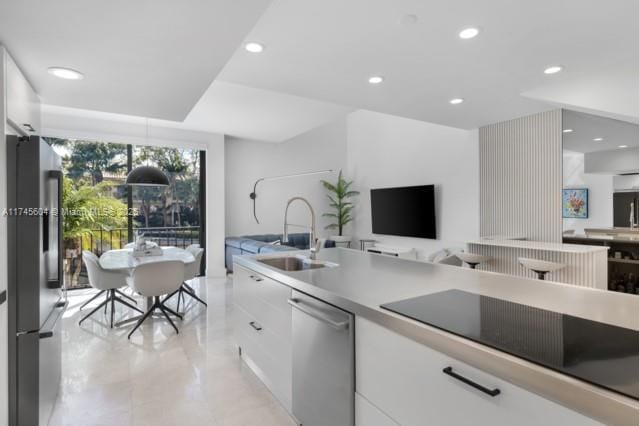 10655 NE Quaybridge Ct Unit C3, Miami, FL 33138 - kitchen featuring appliances with stainless steel finishes, open floor plan, white cabinetry, recessed lighting, and modern cabinets