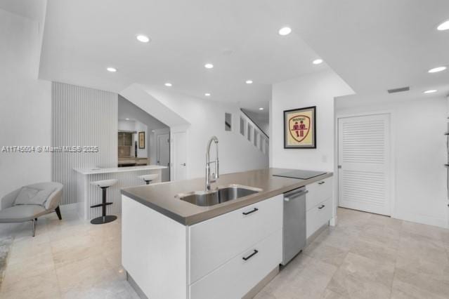 10655 NE Quaybridge Ct Unit C3, Miami, FL 33138 - kitchen with stainless steel dishwasher, modern cabinets, white cabinetry, a kitchen island with sink, and recessed lighting