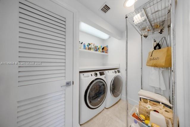 10655 NE Quaybridge Ct Unit C3, Miami, FL 33138 - washroom featuring washer and clothes dryer and light colored carpet