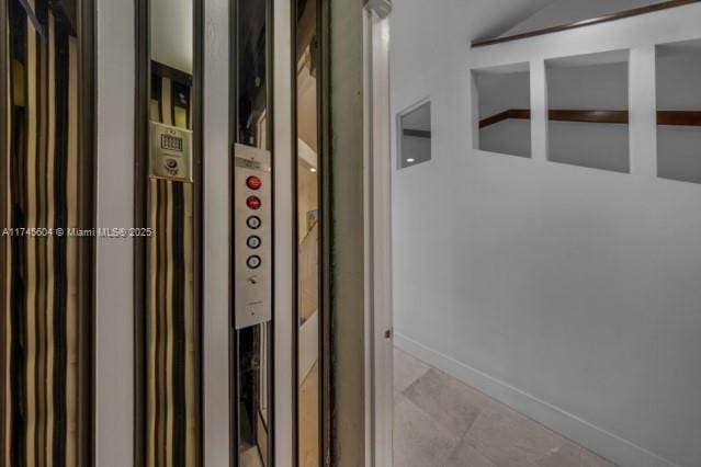 10655 NE Quaybridge Ct Unit C3, Miami, FL 33138 - elevator featuring baseboards