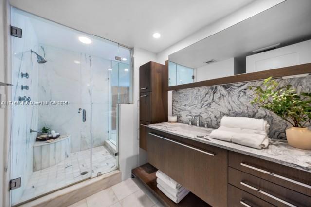 10655 NE Quaybridge Ct Unit C3, Miami, FL 33138 - full bath featuring vanity, a marble finish shower, decorative backsplash, and recessed lighting