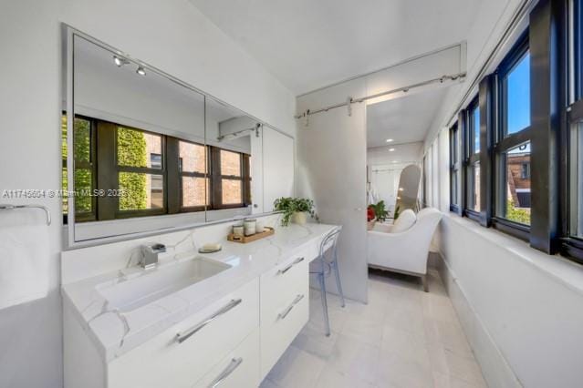 10655 NE Quaybridge Ct Unit C3, Miami, FL 33138 - full bathroom featuring double vanity and a freestanding tub