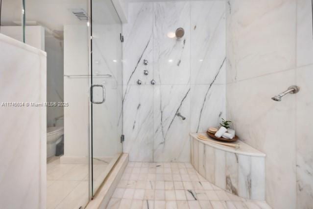 10655 NE Quaybridge Ct Unit C3, Miami, FL 33138 - bathroom with a marble finish shower and tile walls