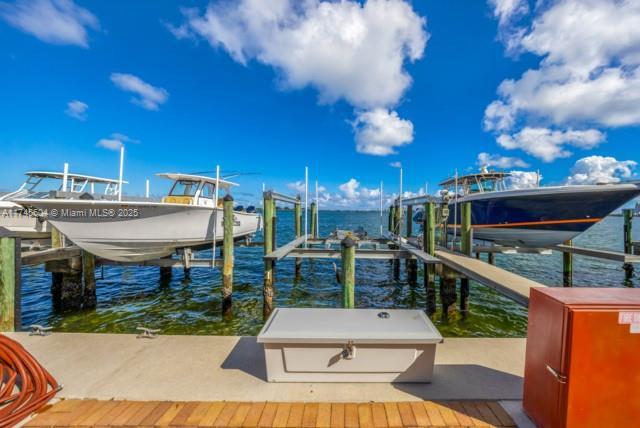10655 NE Quaybridge Ct Unit C3, Miami, FL 33138 - dock area featuring boat lift and a water view