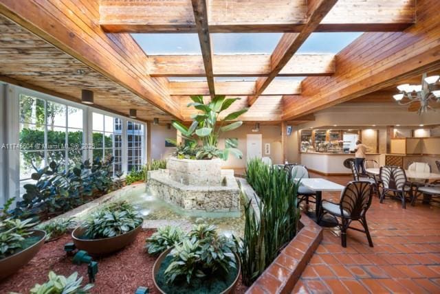 10655 NE Quaybridge Ct Unit C3, Miami, FL 33138 - building lobby featuring coffered ceiling and beamed ceiling