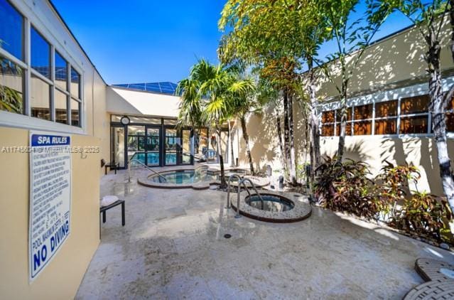 10655 NE Quaybridge Ct Unit C3, Miami, FL 33138 - view of patio / terrace featuring a community pool