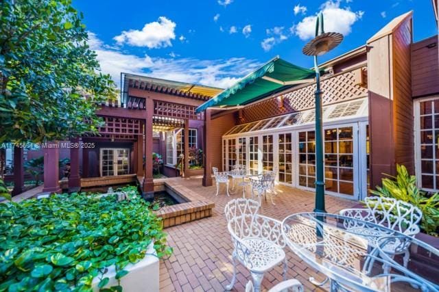 10655 NE Quaybridge Ct Unit C3, Miami, FL 33138 - view of patio / terrace with outdoor dining area
