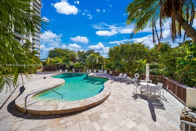 10655 NE Quaybridge Ct Unit C3, Miami, FL 33138 - community pool featuring a patio area