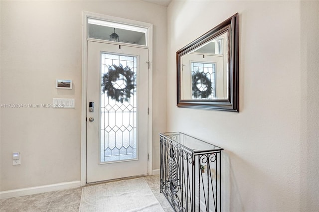 entrance foyer featuring light tile patterned flooring