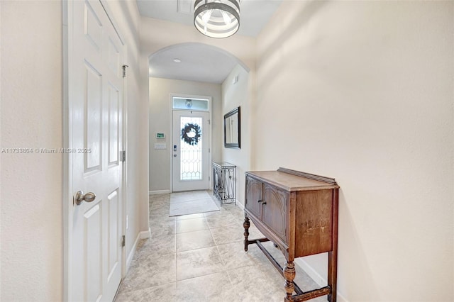 entrance foyer with light tile patterned floors