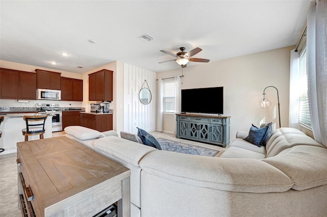 living room featuring ceiling fan