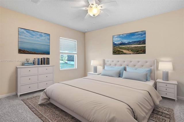 bedroom featuring ceiling fan and a textured ceiling