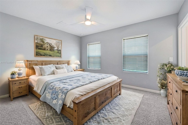 bedroom with light colored carpet and ceiling fan