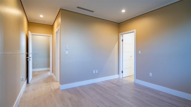 spare room with light wood-type flooring