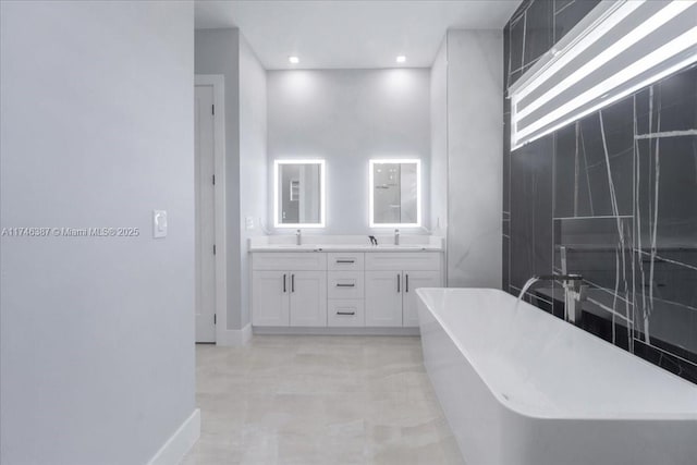 bathroom featuring vanity and a bathing tub