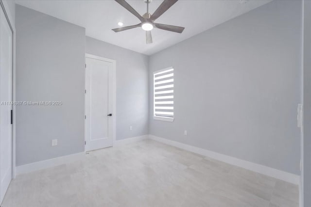 spare room with ceiling fan