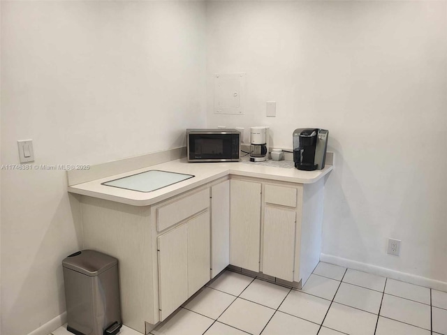 kitchen with light tile patterned floors