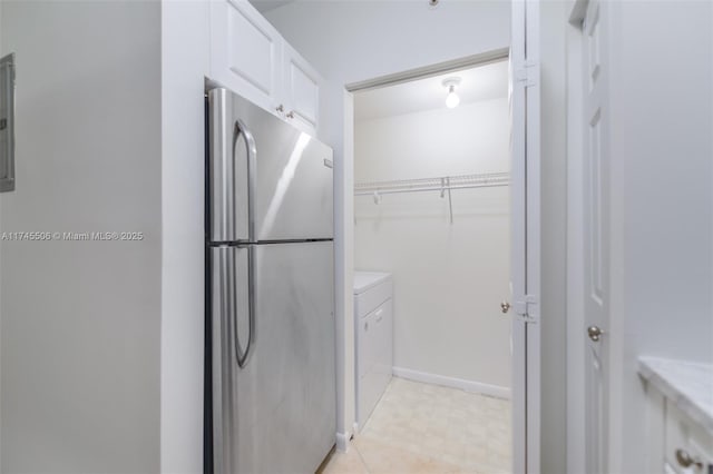 17100 N Bay Rd Unit 1303, Sunny Isles Beach, FL 33160 - laundry area featuring light floors and baseboards