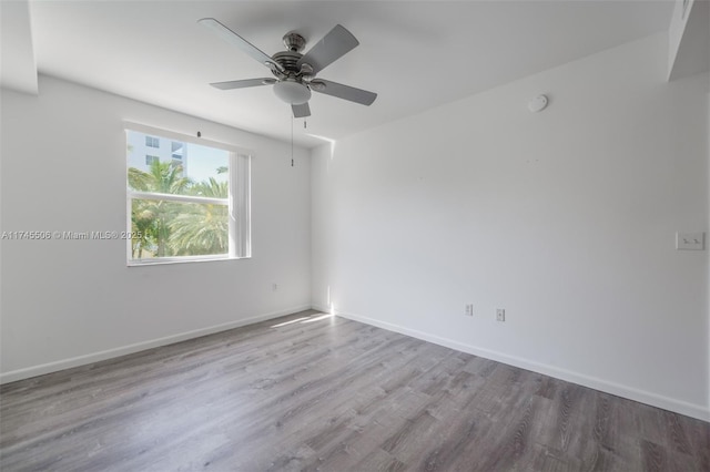 spare room featuring ceiling fan and hardwood / wood-style floors