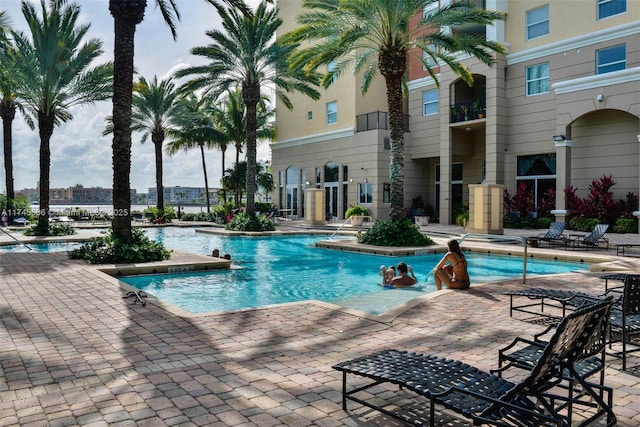 view of swimming pool with a patio