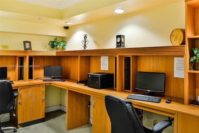 office area featuring carpet floors and built in desk