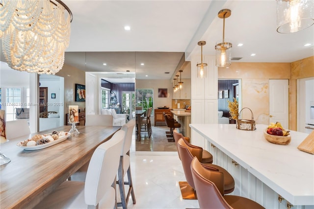 dining room with recessed lighting and visible vents