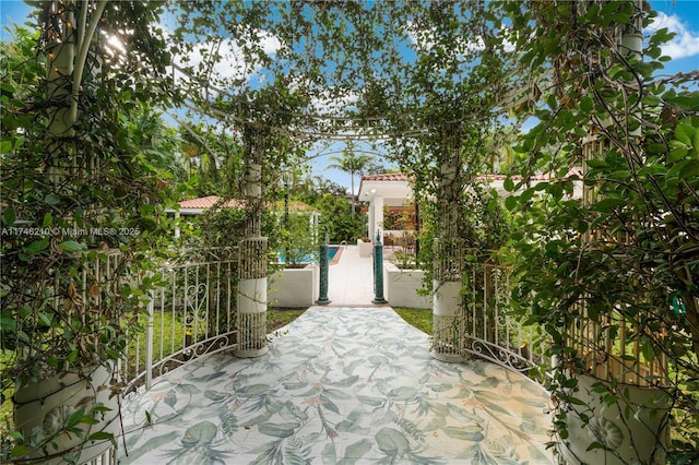 view of gate featuring a patio