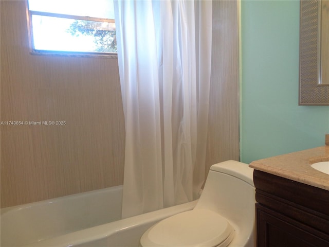 full bath featuring shower / bath combo, vanity, and toilet