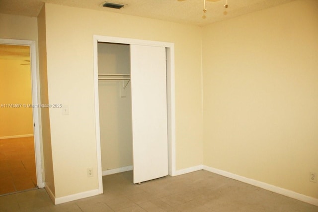 unfurnished bedroom with a closet