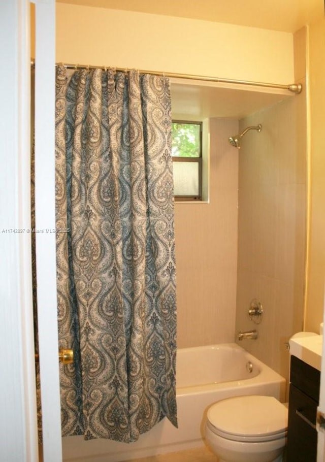 full bathroom with shower / bathtub combination with curtain, vanity, and toilet