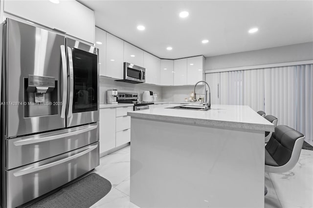 7140 W 2nd Way Unit 7140, Hialeah, FL 33014 - kitchen with appliances with stainless steel finishes, modern cabinets, light marble finish floors, a sink, and recessed lighting
