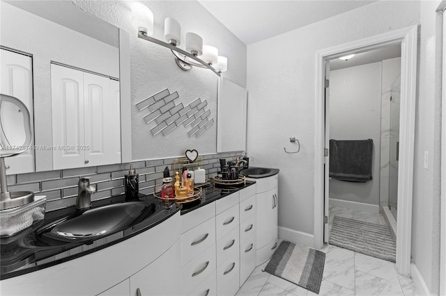 7140 W 2nd Way Unit 7140, Hialeah, FL 33014 - full bath featuring marble look tile flooring, double vanity, decorative backsplash, a stall shower, and baseboards