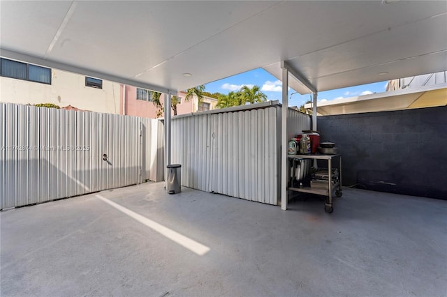 view of gate featuring a patio area and fence