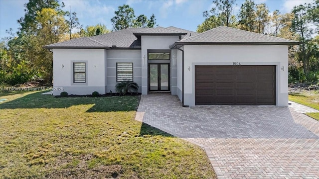 prairie-style home with a garage and a front yard