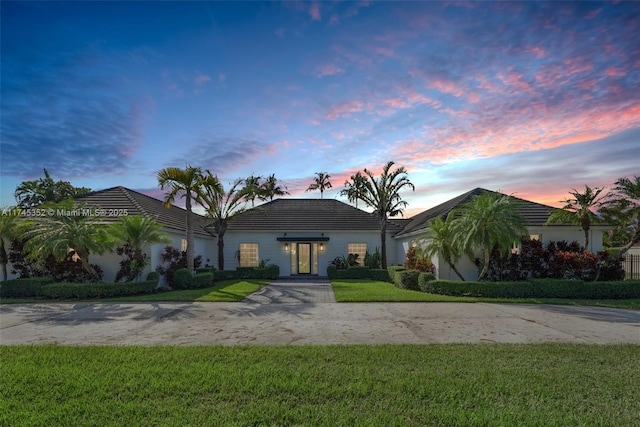 ranch-style house featuring a yard