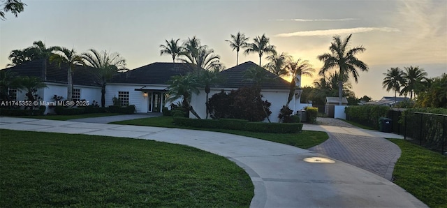 ranch-style house featuring a yard