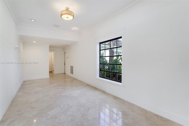 spare room with crown molding