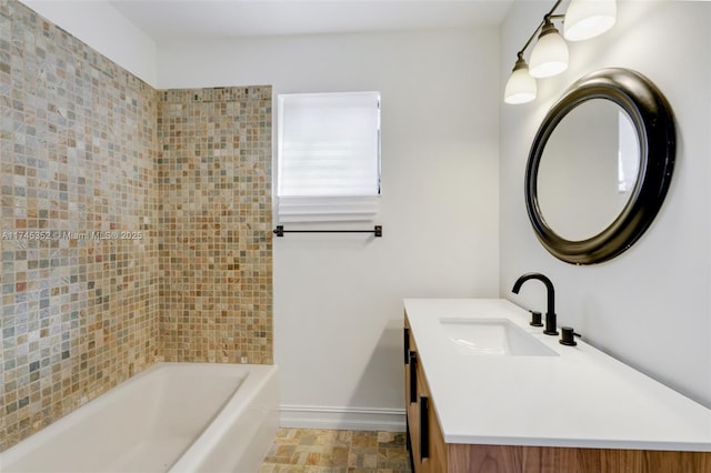 bathroom with vanity and a tub